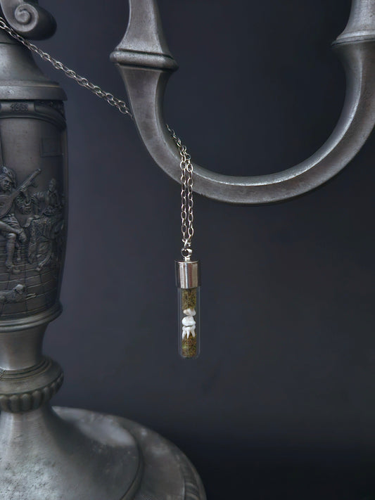 Rat teeth oddity vial