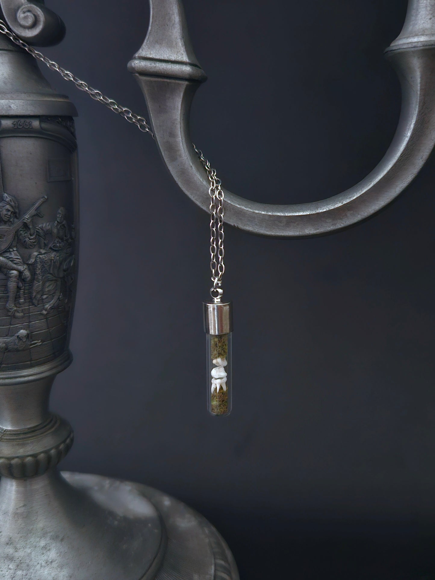 Rat teeth oddity vial