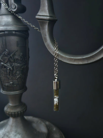 Rat teeth oddity vial