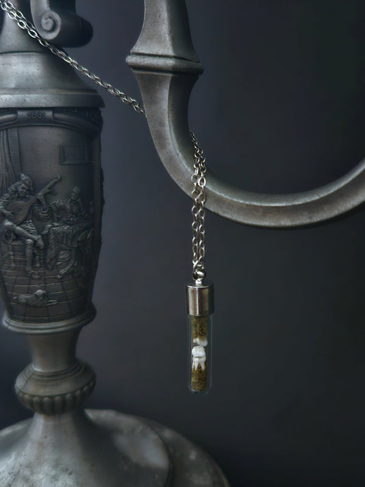 Rat teeth oddity vial